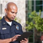 police officer using tablet for investigations